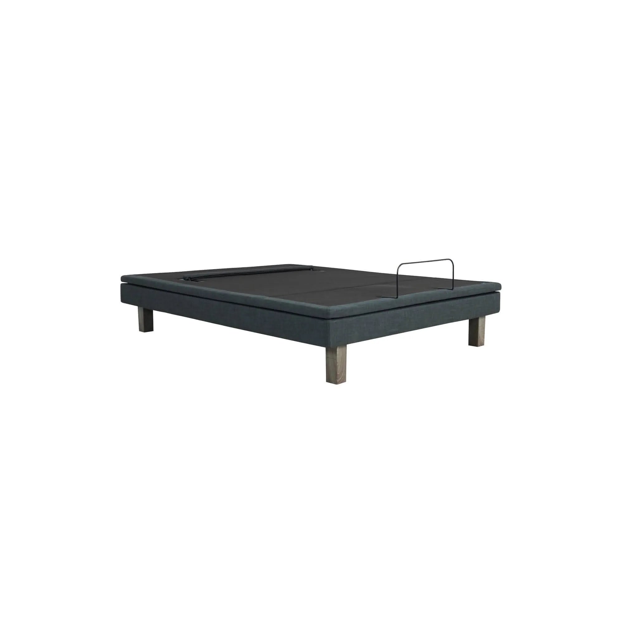 Ergomotion Exceed adjustable bed base in dark gray fabric with wooden legs and a black mattress retainer bar.